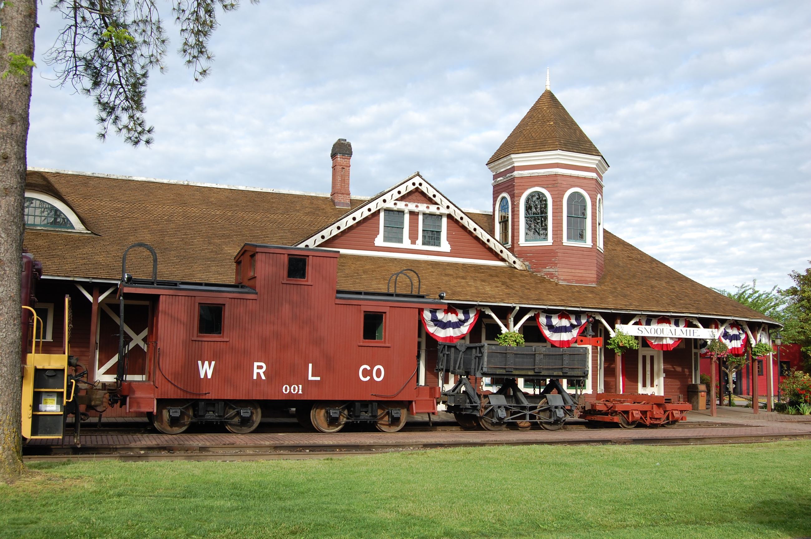 This is a photo of the Historic Snoqualmie Train Depot grounds with trains.