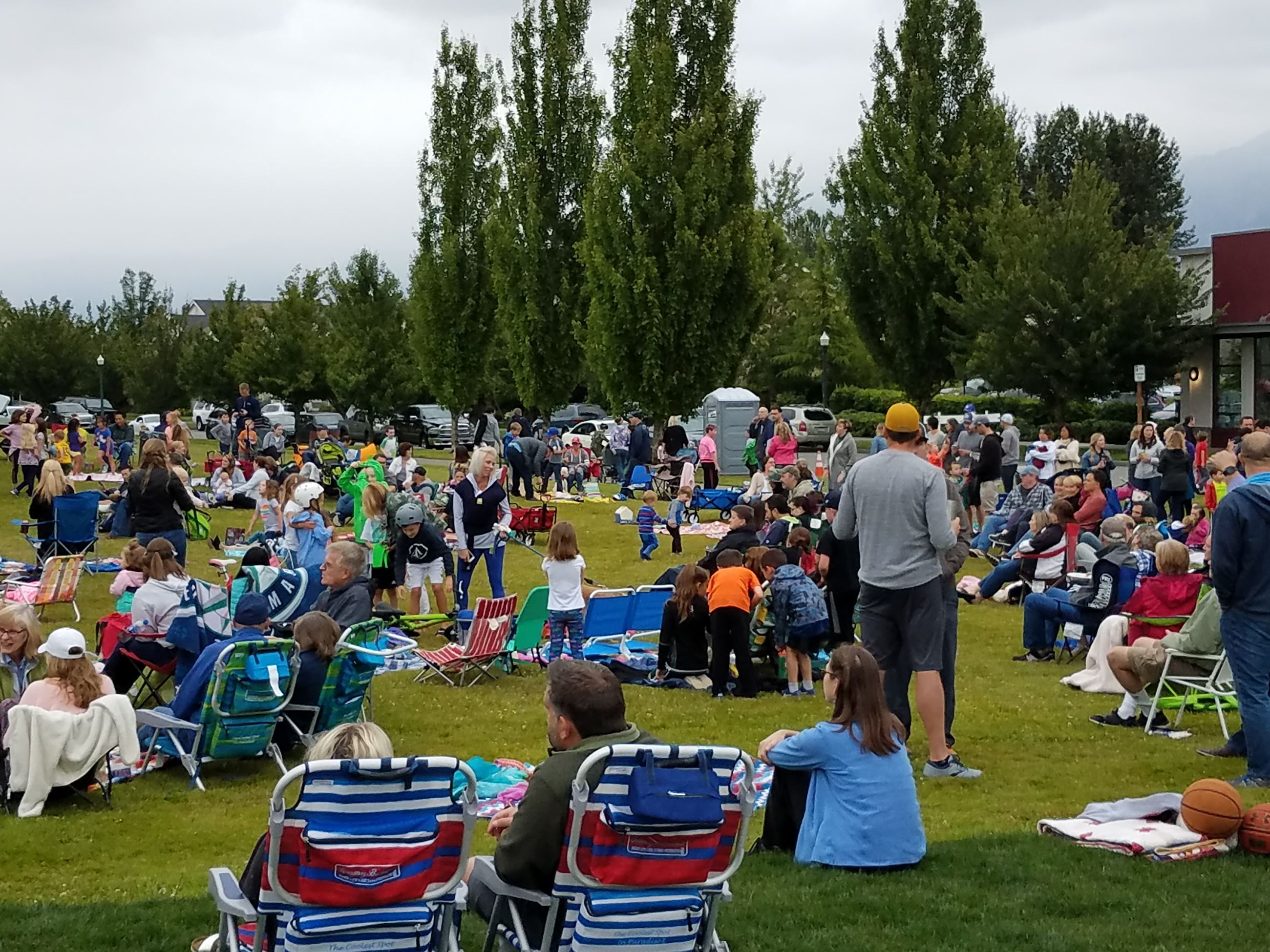 This is a picture of the audience enjoying live music at Snoqualmie Community Park.