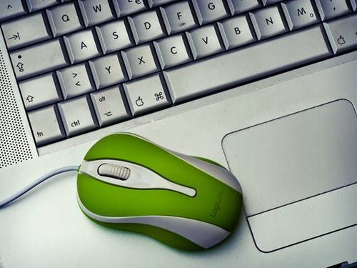 This is a stock image of a laptop and mouse.