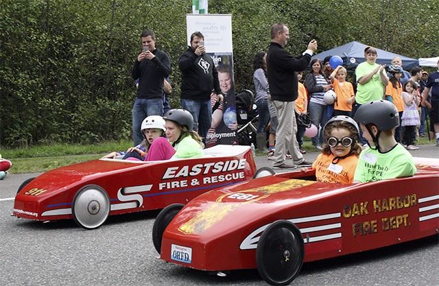 This is a picture of children in a gravity car at the LEO Challenge Series in Snoqualmie.