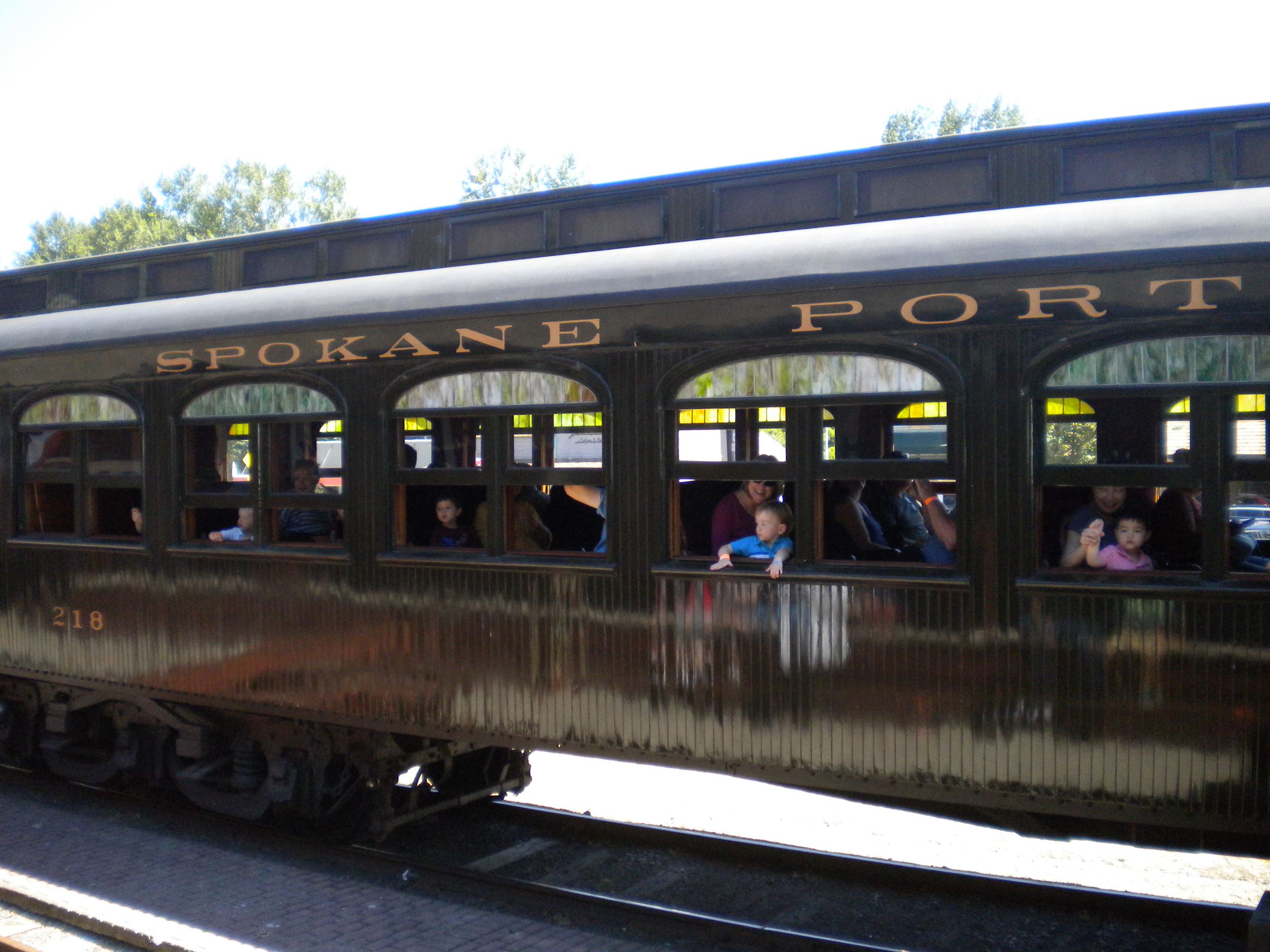 This is a picture of families on a train excursion at the Northwest Railway Museum.